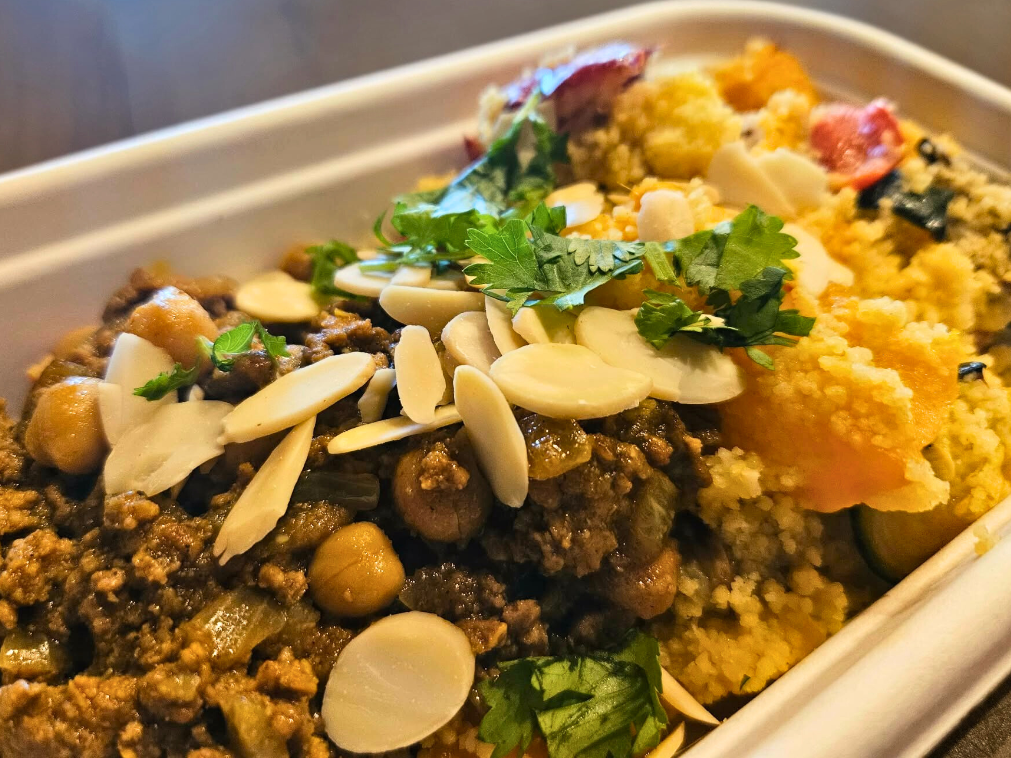 Lamb tagine with a warm cous cous and roast vegetable salad