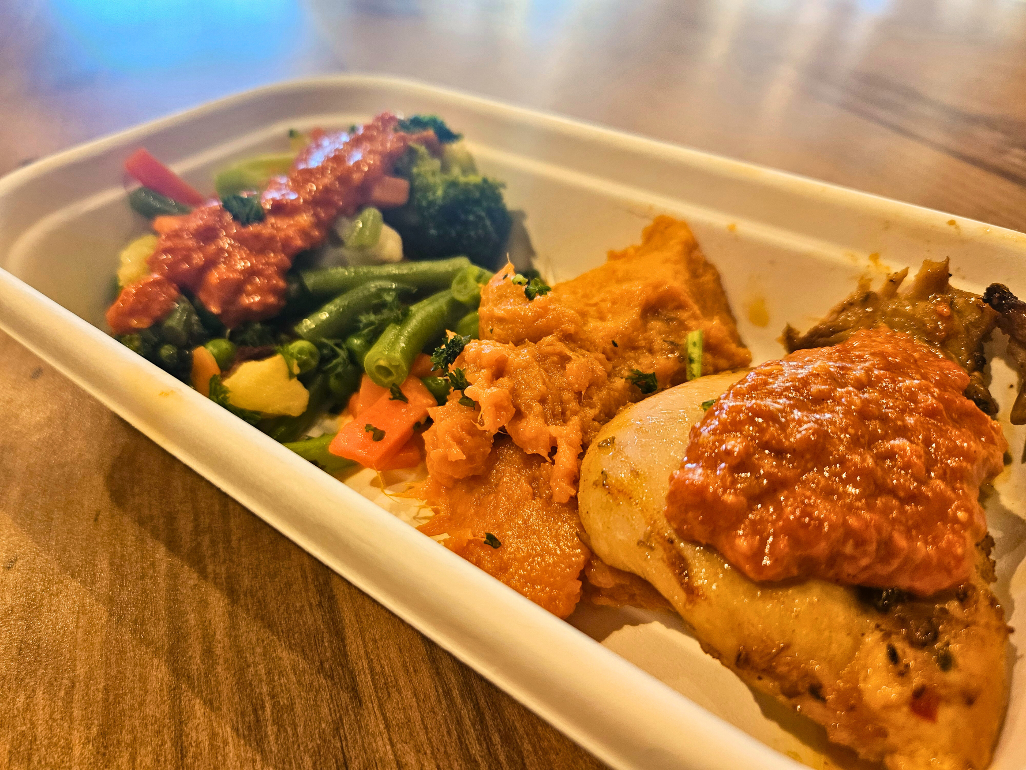 Medium sized Portuguese Chicken with Peri Peri Fusion Sauce sided with a sweet potato mash