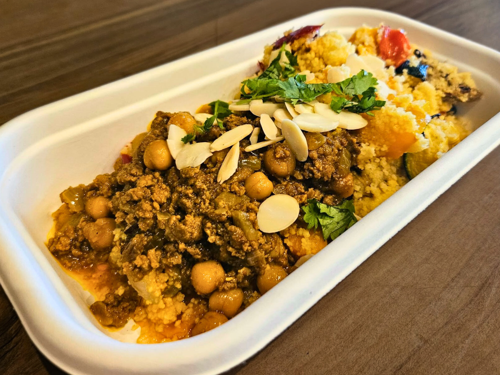 Lamb tagine with a warm cous cous and roast vegetable salad