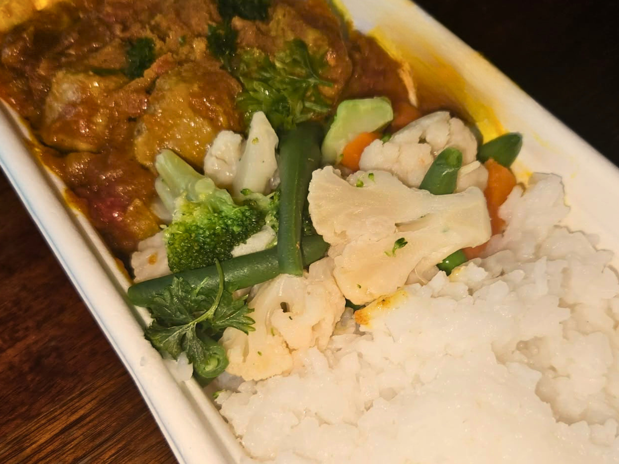 Curried Sausages with rice and Seasonal Vegetables